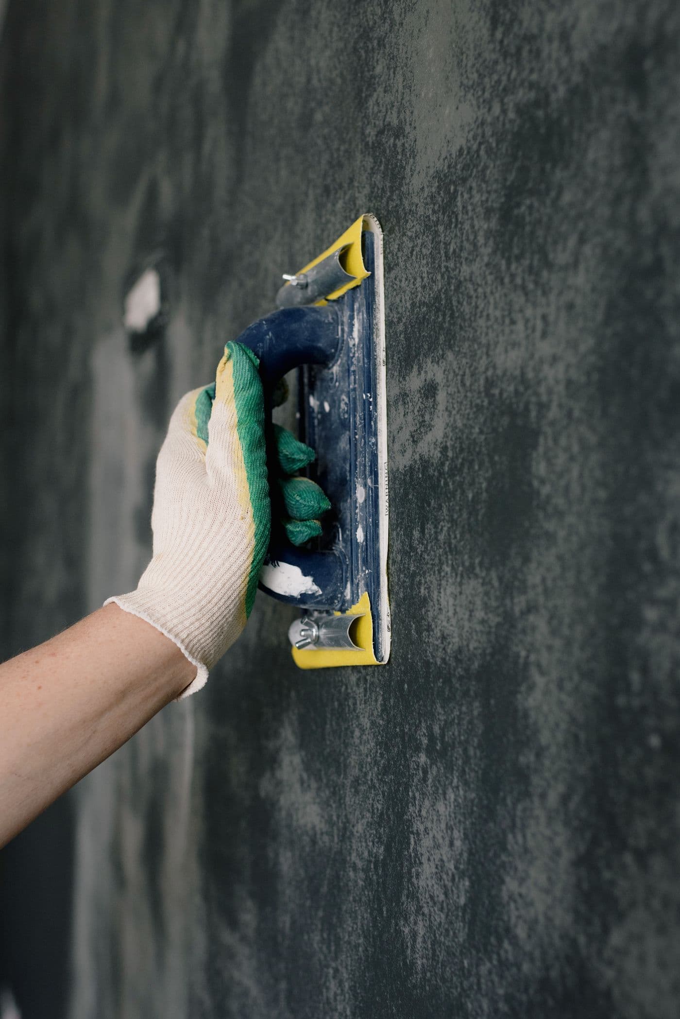 Plasterer skimming a prepared wall